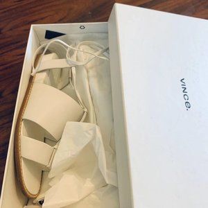 New, still in box White leather sandal…